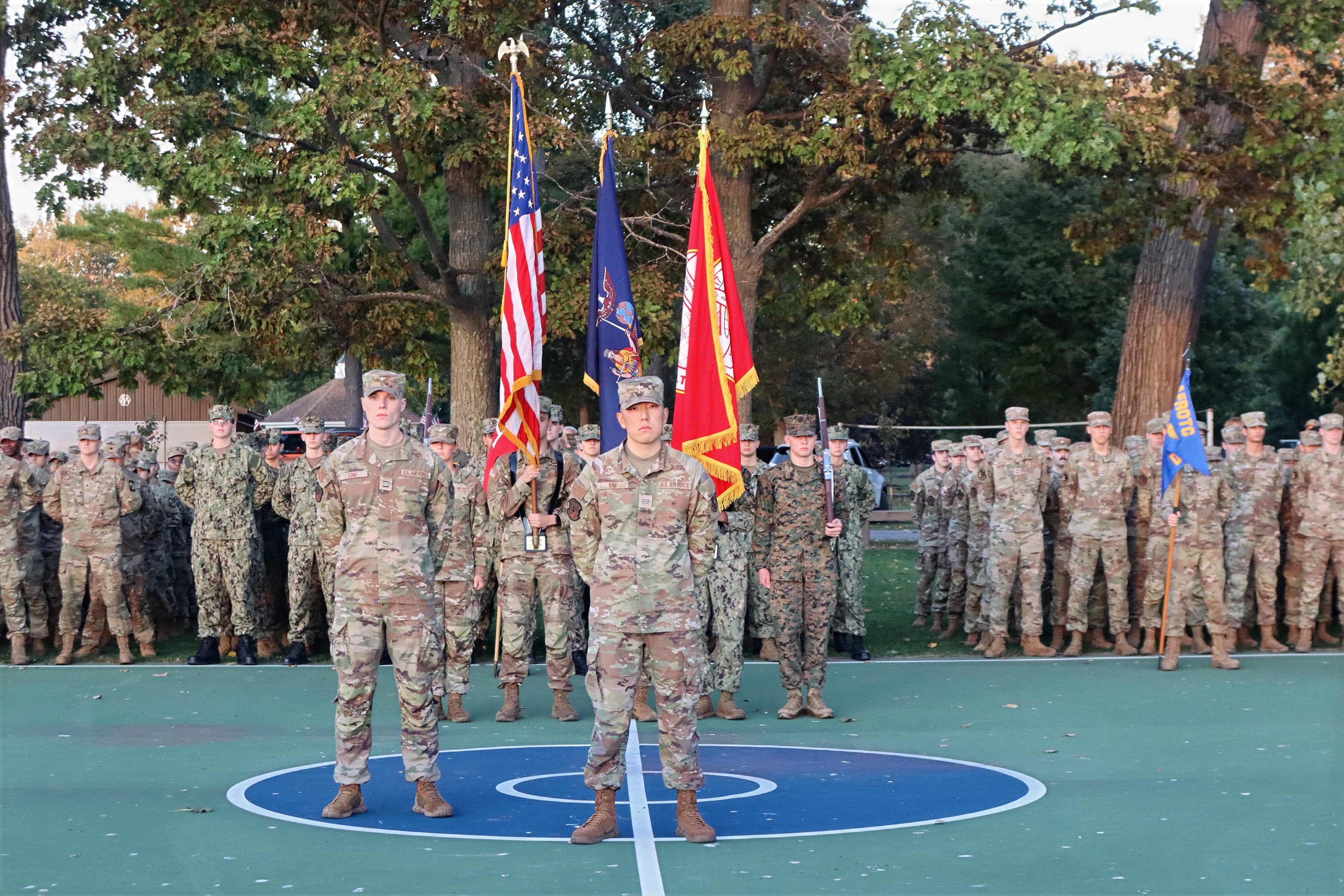 A joint formation of cadets stands with the national colors and service flags at the Watchfire ceremony.