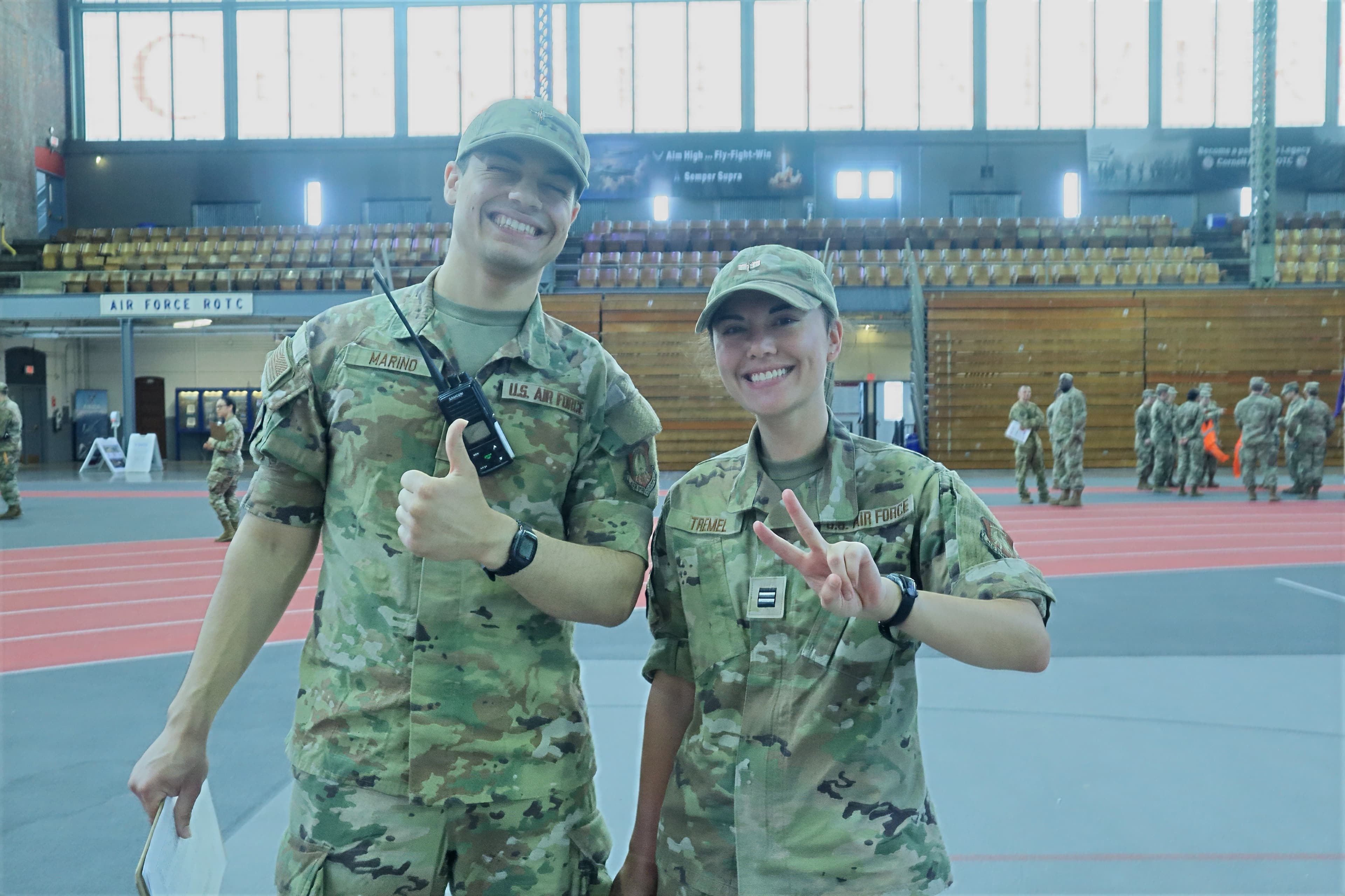Two cadets give thumbs up while monitoring a radio in Barton Hall.