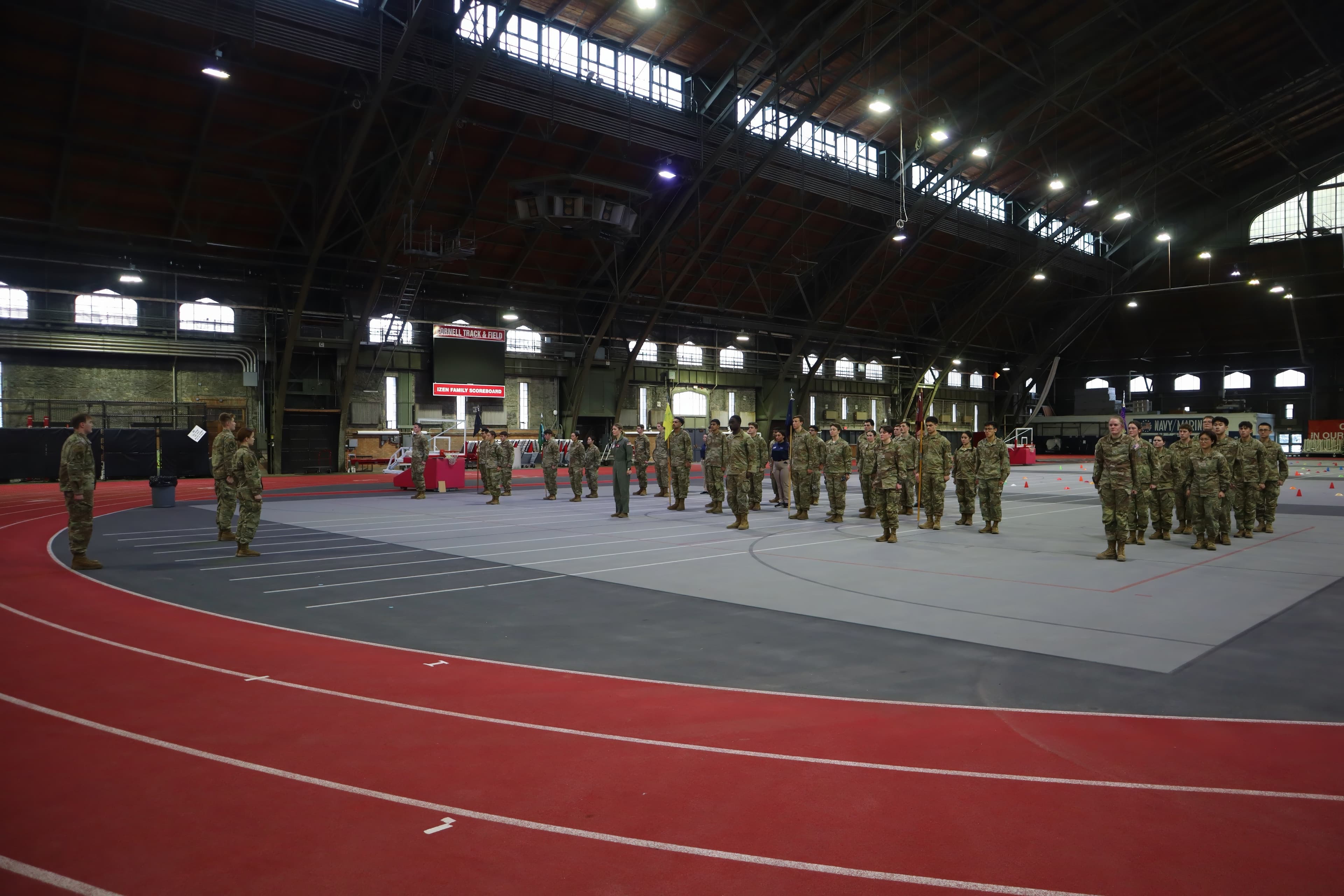 The cadet wing stands in formation across the Barton Hall track.